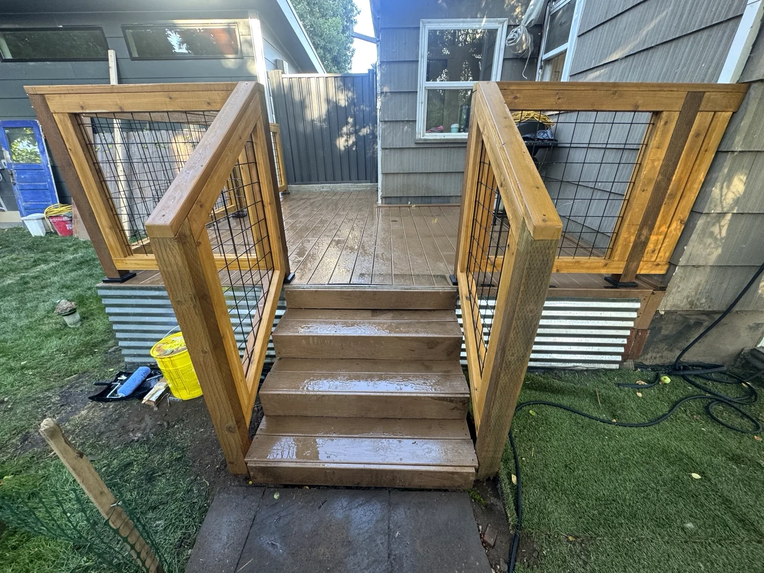 Completed custom exterior deck and wood railing project